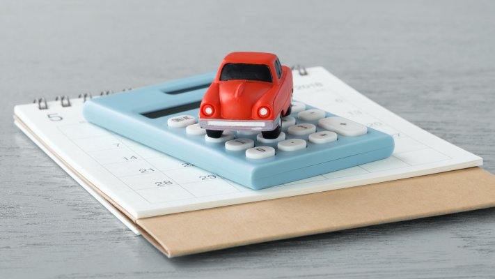 car insurance service policy company root car insurance features red toy car on calculator and notepad calendar